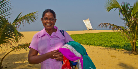 Chandrare sells sarongs at the beach at Negumbo, Sri Lanka. Photo / Alex Robertson
