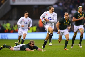English fullback Alex Goode breaks away from South African defenders at Twickenham. Photo / Getty Images