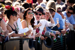 Racing fans take in the atmosphere at the Karaka Million at Ellerslie yesterday. Photo / Dean Purcell