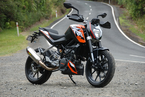 The KTM 200 Duke's light weight and fiendish gearing deliver attitude in spades, helped by a design that feels as purposeful as it looks. Photo / Jacqui Madelin