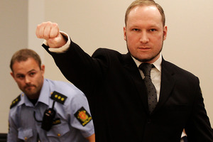 Anders Behring Breivik, makes a salute after arriving in the court room at a courthouse in Oslo during his trial. Photo / AP