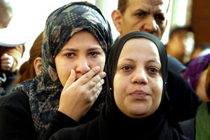 Relatives mourn during the funeral of policemen killed on Saturday in Port Said, in Cairo, Egypt. Photo / AP