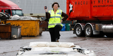 Police Minister Anne Tolley stands on Daniel Briant's Nissan, the first car to be crushed in New Zealand under boy-racer legislation. Photo / Mark Mitchell