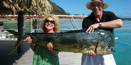 Kerre Woodham and Tom McIvor with a 26kg mahi mahi they caught off Moorea. Photo / Supplied
