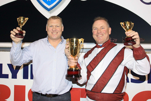 Tim and Anthony Butt happily display the plunder from their latest raid across the Ditch, after the Ballarat Cup won by Mah Sish. Photo / Stuart McCormick