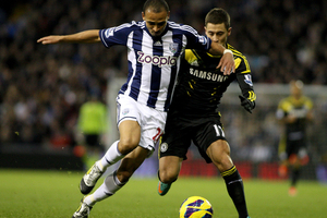 Peter Odemwingie wrestles the ball away from Chelsea's Eden Hazard. Photo / Offside.