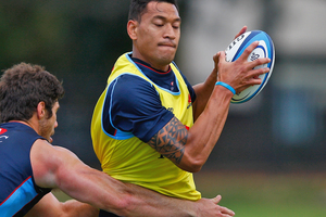 Israel Folau is tackled during a Waratahs training session. Photo / Getty Images