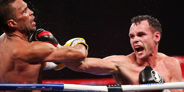 Daniel Geale lands a right on Anthony Mundine during their IBF Middleweight Title bout. Photo / Getty Images