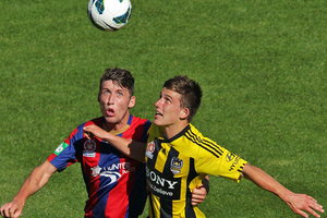 Louis Fenton of the Phoenix and Scott Neville of the Jets compete for the ball. Photo / Getty Images