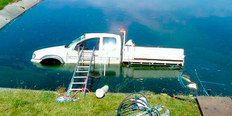 The Fulton Hogan ute was partially submerged in the oxidation pond at Heriot, West Otago. Photo / Supplied
