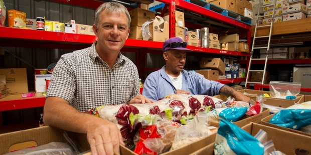 Ian Foster and Felipo Lovi at the South Auckland Christian Foodbank, which puts together up to 60 parcels a week. Photo / Kellie Blizard