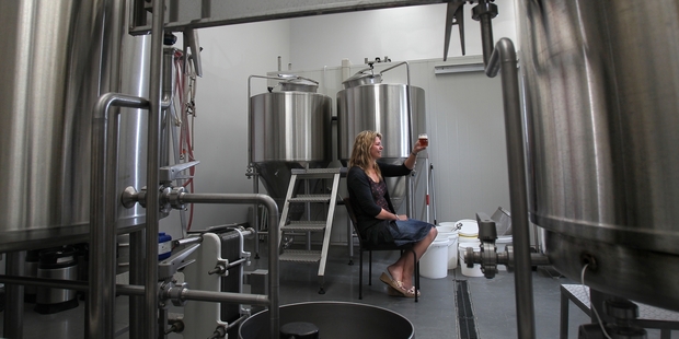 A GOOD DROP: Catherine Fitzpatrick of Fitzpatrick's Brewing Co. samples some of the product going to bars locally as well as Auckland and Wellington.PHOTOS/JOHN BORREN