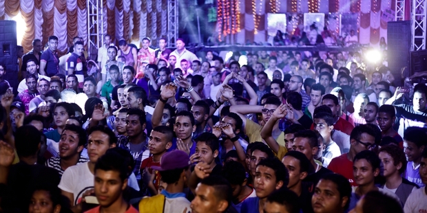 Laser lights add to the electronic beat of mahraganat in Egypt's toughest neighbourhoods, performed by singers such as DJ Sadat (below). Photo / AP