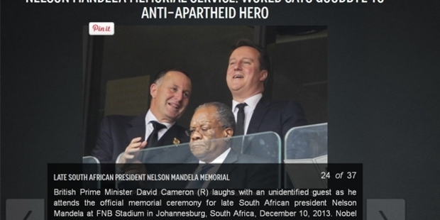 The New York Daily News had no idea who that man was talking to British PM David Cameron.