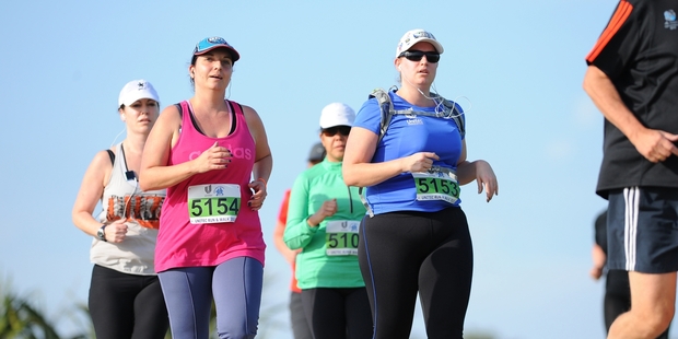 Runner Katie Jones (5153) gets a little help from her friends.