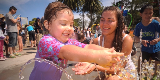Ashleigh Slaven and her daughter Nadia, 2, having fun at the new Splash Pad at Auckland's Potters Park, which opened yesterday. Photo / Jason Dorday