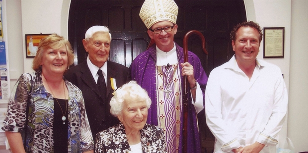 EMOTIONAL: Jack and Vera Katavich with their daughter Beverley, son Mijo and Catholic Bishop of Auckland Patrick Dunn, who presented the couple with Bene Merenti medals and papal awards