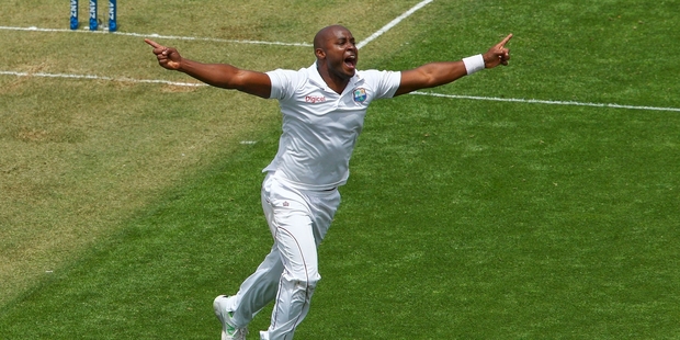 Tino Best celebrates after taking the wicket of Kane Williamson but a spilled catch denied him the chance to dismiss Ross Taylor for a duck at the Basin Reserve. Photo / Getty Images
