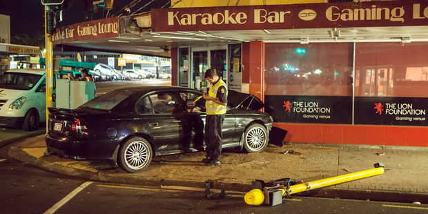 Police have made several arrests after a fight broke out between the occupants of a Holden Commodore which crashed into a bar in Papatoetoe, Auckland. Photo / Bradley Ambrose
