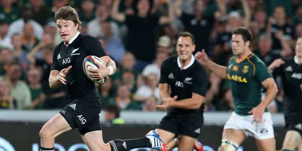 Beauden Barrett of the All Blacks breaks clear to score the bonus point winning fourth try during the Rugby Championship match between South Africa and the All Blacks. Photo / Getty Images.