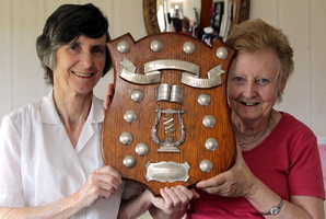 Pat Williams (left) and Eris Walker have been thrilled at the resurfacing of a 1921 shield for a children's choir. Photo/Stuart Munro
