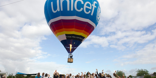 Commercial hot air balloon pilot Andrew Parker pictured with children from Balmoral School in Auckland. Photo / Chris Gorman
