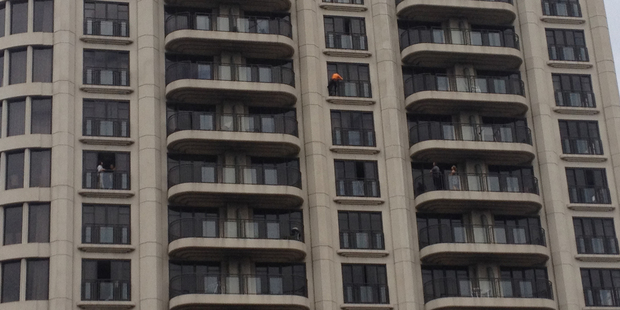 French climber Alain Robert climbing Auckland's Metropolis building today. New Zealand Herald iPhone photograph by Greg Bowker