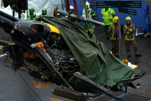A police helicopter crash onto a crowded Glasgow pub that has killed nine people and injured more than two dozen. Photo / AP