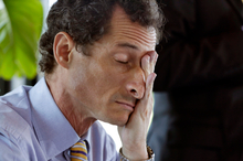 New York mayoral candidate Anthony Weiner rubs his eyes during a candidate forum. Photo / AP