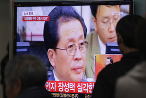 People watch a TV news program showing North Korean leader Kim Jong Un's uncle, Jang Song Thaek. Photo / AP