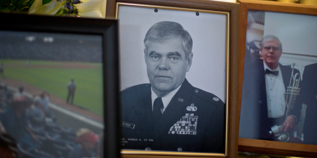 Photo of Ret. Lt. Col. Ronald Westbrook sits on the coffee table in his home. Photo / AP