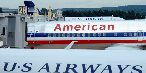 American Airlines is now out of bankruptcy protection and US Airways has got a partner, as the two airlines now have formalised their merger. Photo / AP