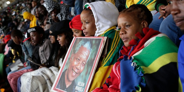 People at a memorial service for Nelson Mandela at the FNB Stadium in Soweto. Photo / AP