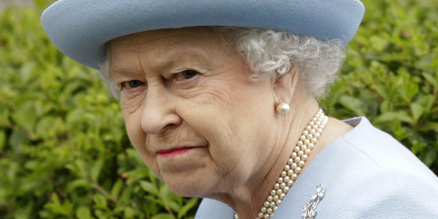 A private investigator convicted of eavesdropping on the voice mails of royal staff told a tabloid editor that The Queen was annoyed because officers ate the nuts laid out for guests. Photo / AP