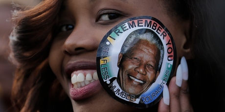A woman visits Mandela's casket. Photo / AP
