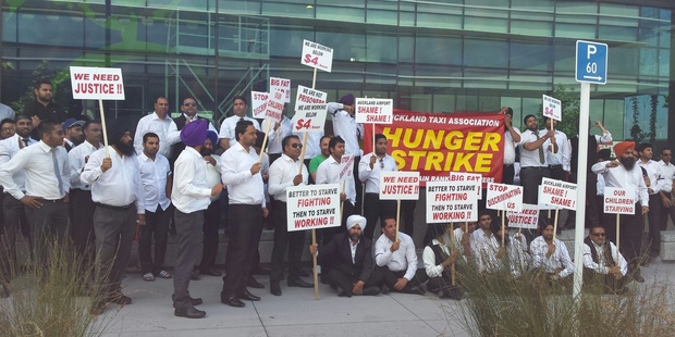 Hunger-striking drivers make their demands heard at Auckland International Airport this morning. Photo / supplied