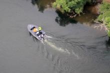 Police comb Waikato River in a search for missing tennis coach Paul Arber. Photo / NZ Police