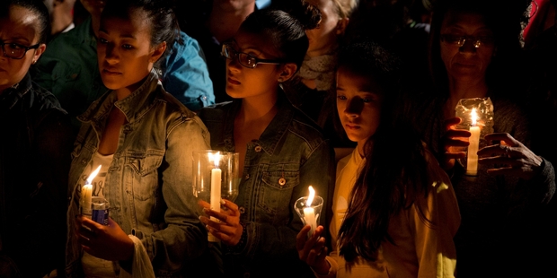 South Africans of all races paid tribute during yesterday's national day of prayer and reflection. Photo / AP