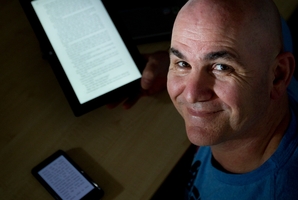 Ian Lawsen got his first eReader sent over from the US in 2007. Photo / Sarah Ivey