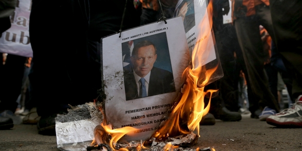 Diplomatic relations between Australia and Indonesia are tense following a spy scandal which has led to protesters burning posters of Prime Minister Tony Abbott. Photo / AP