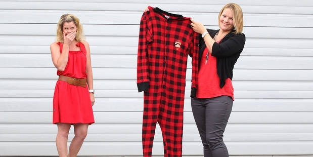 BAD CHOICE: Rebecca Kneale was given a onesie for Mother's Day and was less than impressed with her husband. Megan Hewett looks on.PHOTO/JOHN BORREN