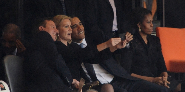 British Prime Minister David Cameron (left), Danish PM Helle Thorning-Schmidt and US President Barack Obama pose for their selfie at Nelson Mandela's funeral. Picture / AP