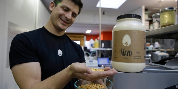 Hampton Creek Foods chief exec Josh Tetrick with a type of yellow pea used to make mayonnaise without eggs. Photo / AP