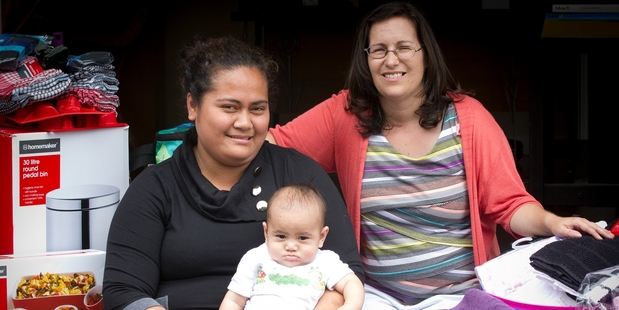 Co-ordinator Christina Teikamata (right) helps a resident and her baby. Photo / Sarah Ivey