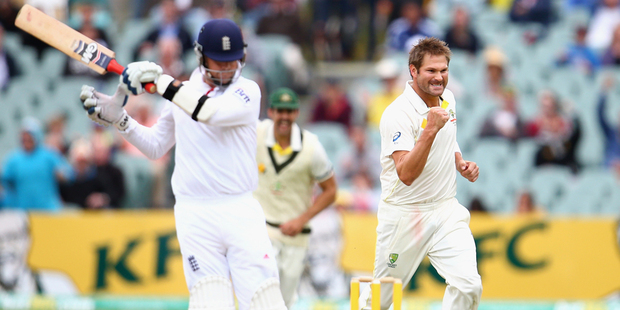 Ryan Harris of Australia celebrates after taking the wicket of Graeme Swann. Photo / Getty