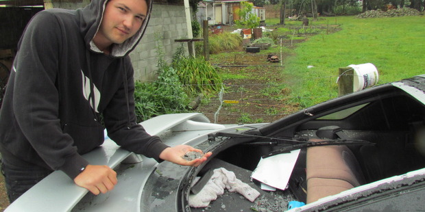 John-Hayden Barrett checks out the damage from the hailstorm in Mayfield. Photo: Myles Hume