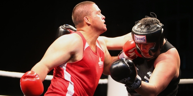 Shaun Lazarus, of Downers, looks for a one-two combo on Ramon Moses, Fulton Hogan, during their Contractors for Charity boxing match. Moses was the eventual winner. Photo/John Stone