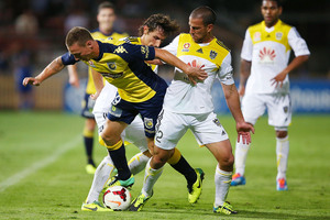 Mitchell Duke of the Mariners competes with the Phoenix defence. Photo / Getty Images