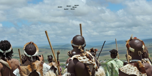 A group of Zulu warriors watch a fly-past during the burial of former South African president Nelson Mandela in Qunu. Photo/ AP