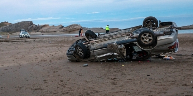 SMASH: A car which rolled on Castlepoint Beach this month. PHOTO/FILE